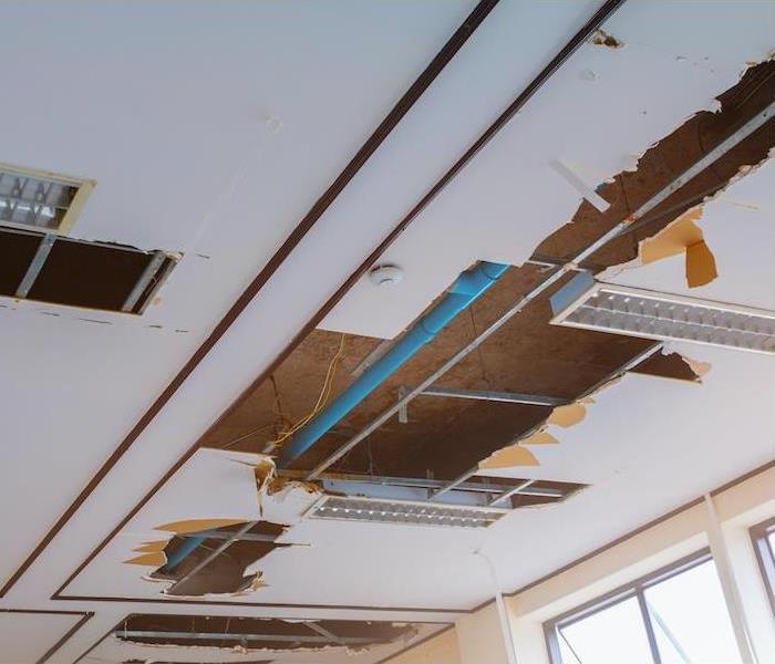 burst pipe in ceiling tile